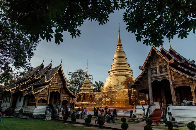 A Magical Evening in Chiang Mai: Private City Tour - Wat Phra Singh under evening lights