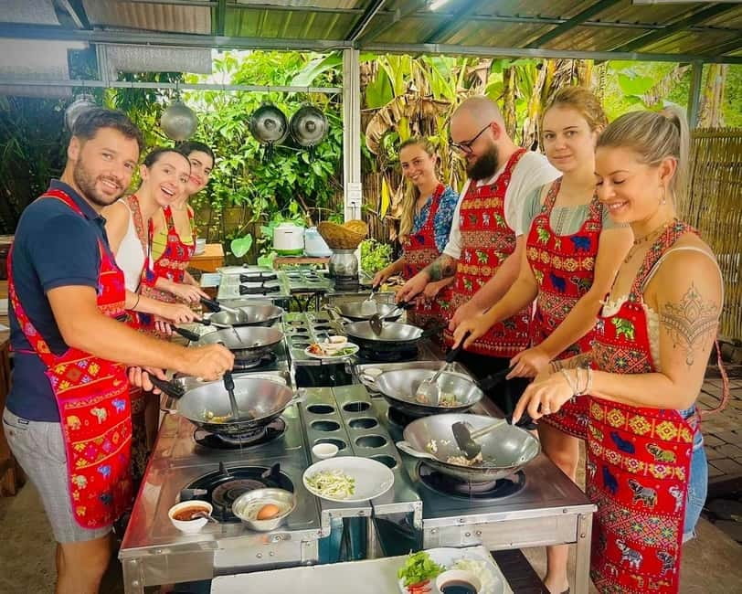 Chiang Mai: Cooking Class, Market & Thai Herbs Garden Tour - Cooking in the organic herb garden