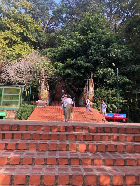Chiang Mai: Wat Pha Lat & Wat Phra That Doi Suthep Tour - Climbing the 306 steps at Wat Phra That Doi Suthep